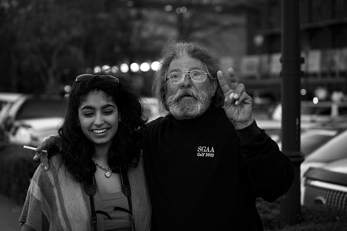 a hippie and a jamican posing