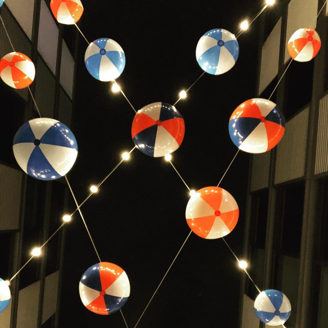 beach ball strung up with lights
